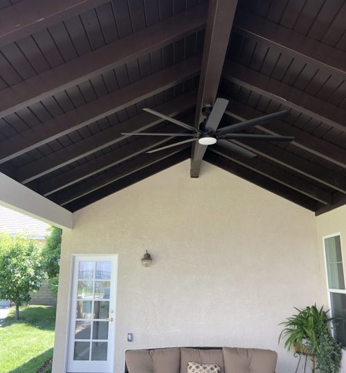 large covered patio with ceiling fan